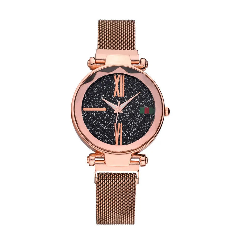 Rose gold ladies watch with round 32mm dial and magnetic stainless steel jewellery clasp on wrist.