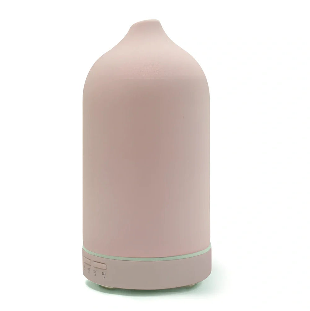 Ceramic ultrasonic aroma diffuser in white with 100ml tank, diffusing mist in home setting, 10cm diameter