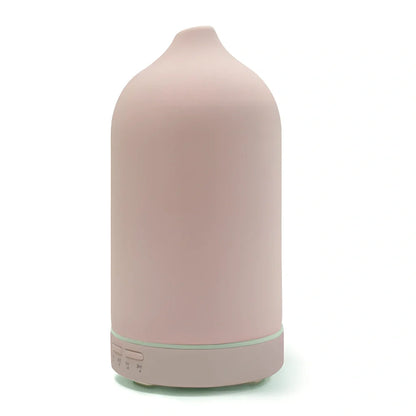 Ceramic ultrasonic aroma diffuser in white with 100ml tank, diffusing mist in home setting, 10cm diameter