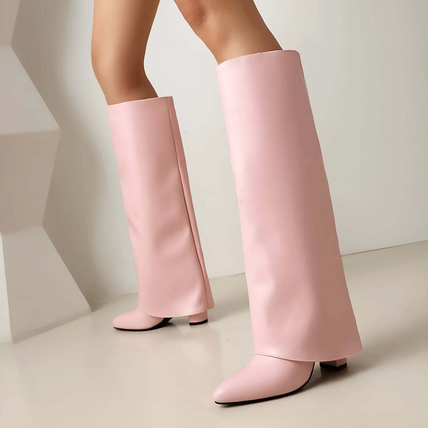 Women's plus size black high heel boot with high shaft and sewing line detailing on artificial PU material.