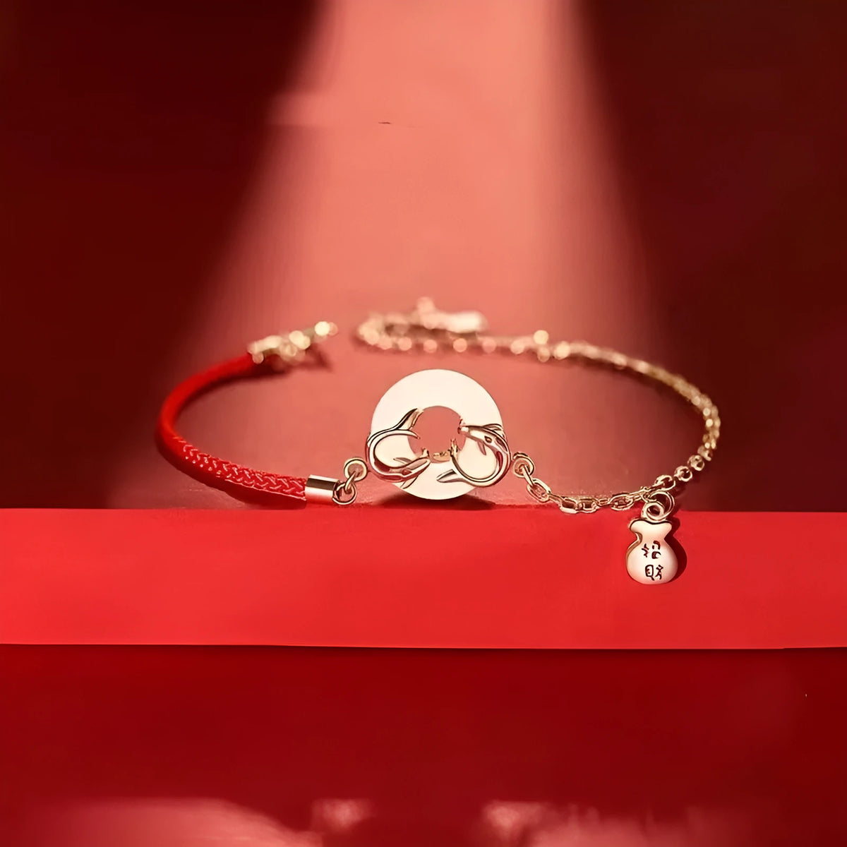 Women's festive koi bracelet with peace buckle in red rope design showing fishtail details