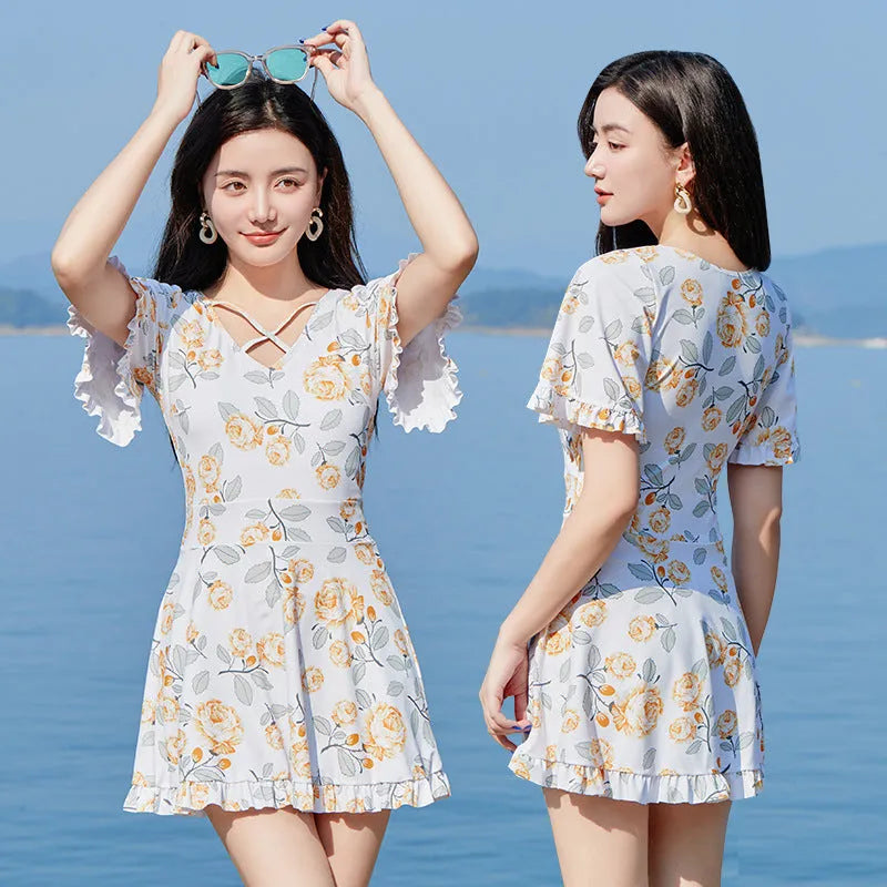 Women's high waist one-piece swimsuit with floral pattern in white flowers or blue design