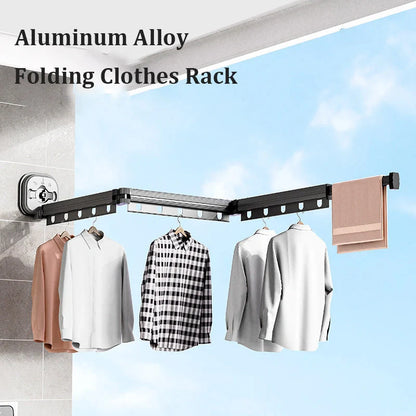 Aluminum retractable drying rack mounted on a window, extending outward for clothes drying