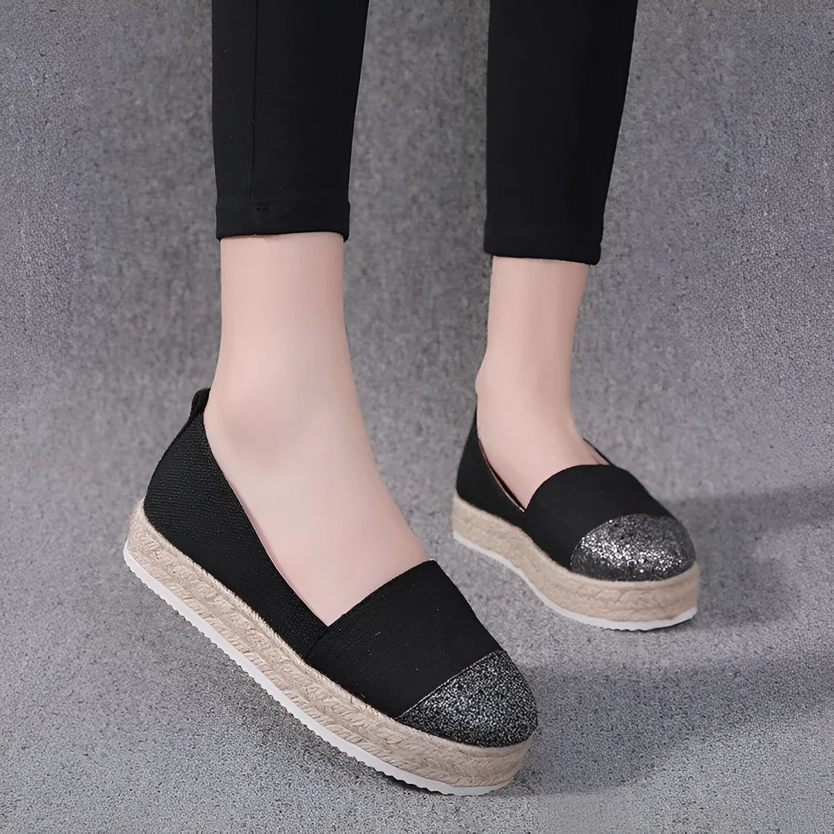 Breathable canvas slip-on flat shoes in black and white colours on a size chart showing 35 to 43.