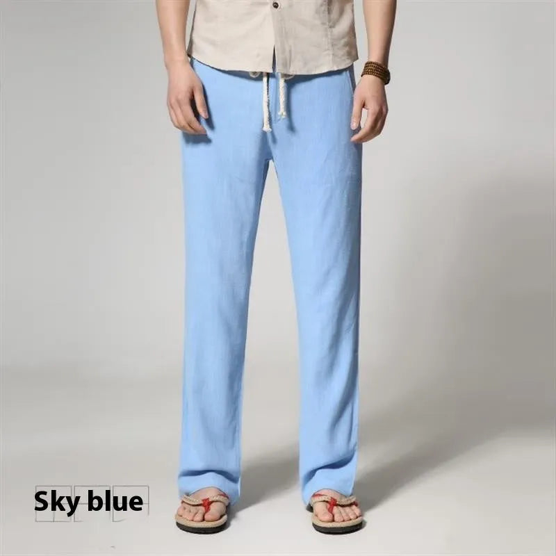 Men's straight leg casual trousers in cotton linen blend fabric showing loose fit and zip fly closure