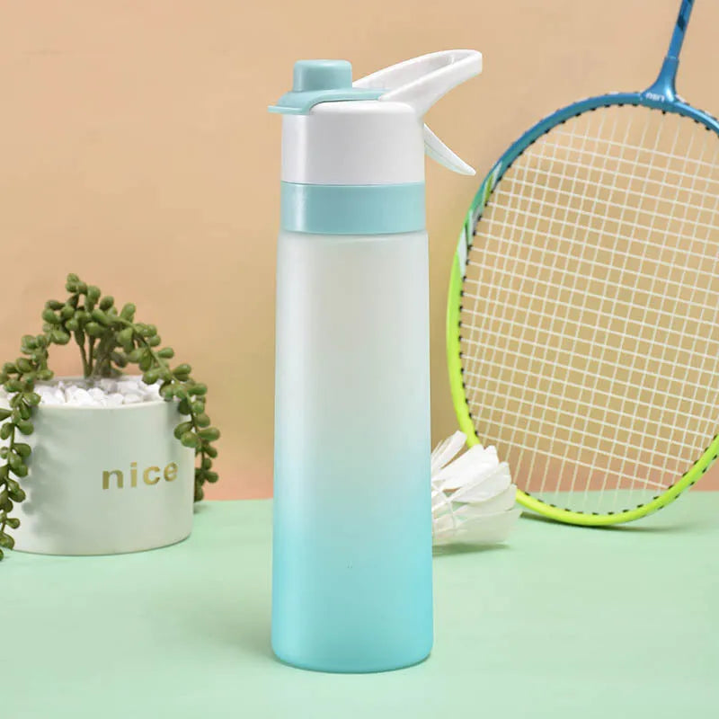 Large plastic spray water bottle with handle strap and leakproof lid in green colour.