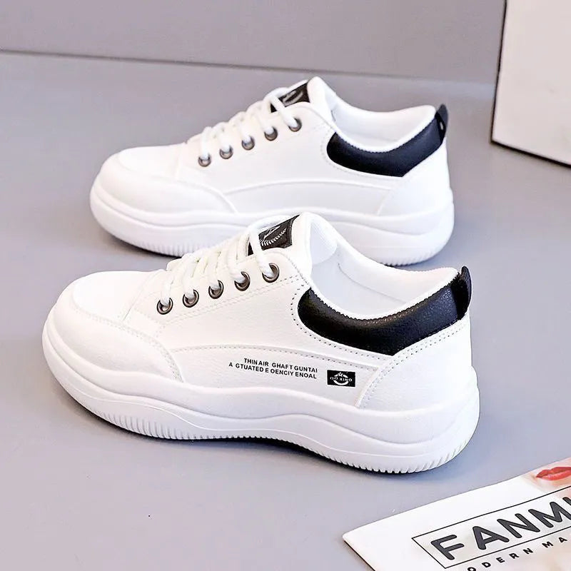 Women's white Korean-style lace-up pumps with a cross strap detail and a mid heel.