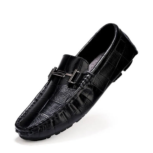 Men's brown leather casual shoes with silver buckle fastening, showing textured rubber sole and low-cut design