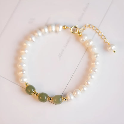 Natural freshwater pearl bracelet with diamond-shaped beads in a Korean style, shown in deep Hetian jade colour.