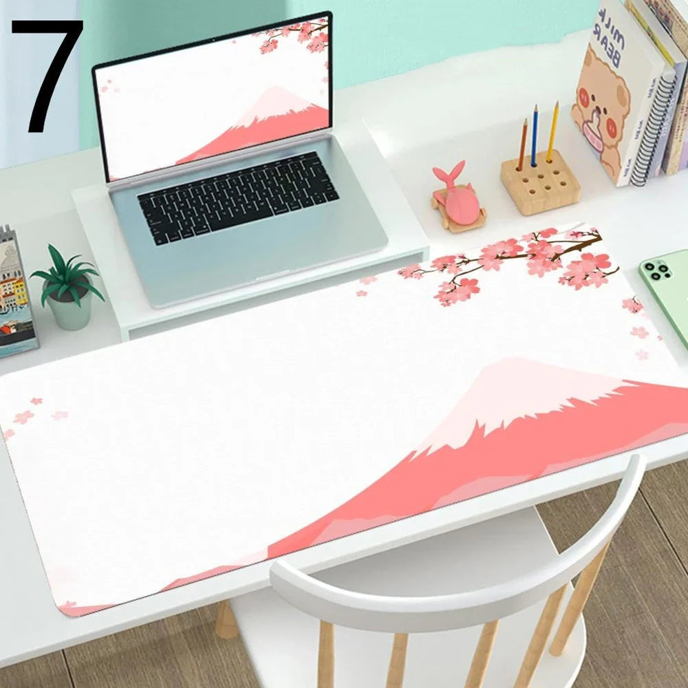 Large gaming mouse desk mat showing printed design on rubber surface with size options up to 400x900mm