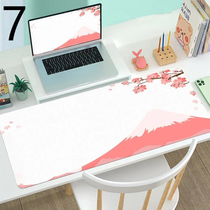 Large gaming mouse desk mat showing printed design on rubber surface with size options up to 400x900mm