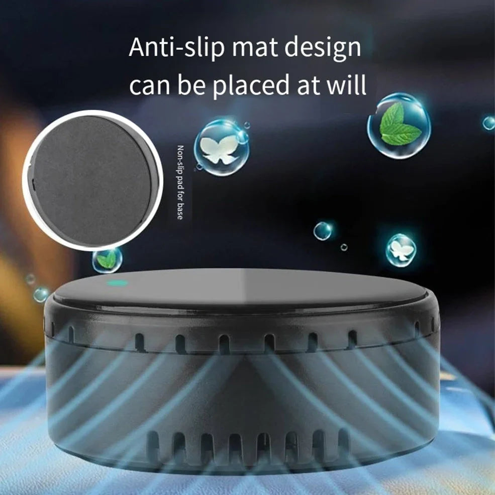 Black solar-powered car humidifier mounted on air conditioning vent with water mist visible