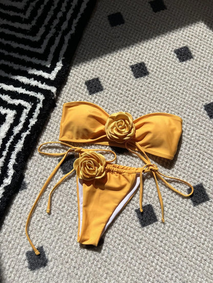 Women's adjustable drawstring tube top swimsuit with high-cut briefs in a solid colour.