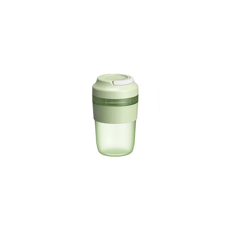 Green portable USB rechargeable blender cup with lid and four stainless steel blades, 400ml capacity.