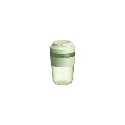 Green portable USB rechargeable blender cup with lid and four stainless steel blades, 400ml capacity.