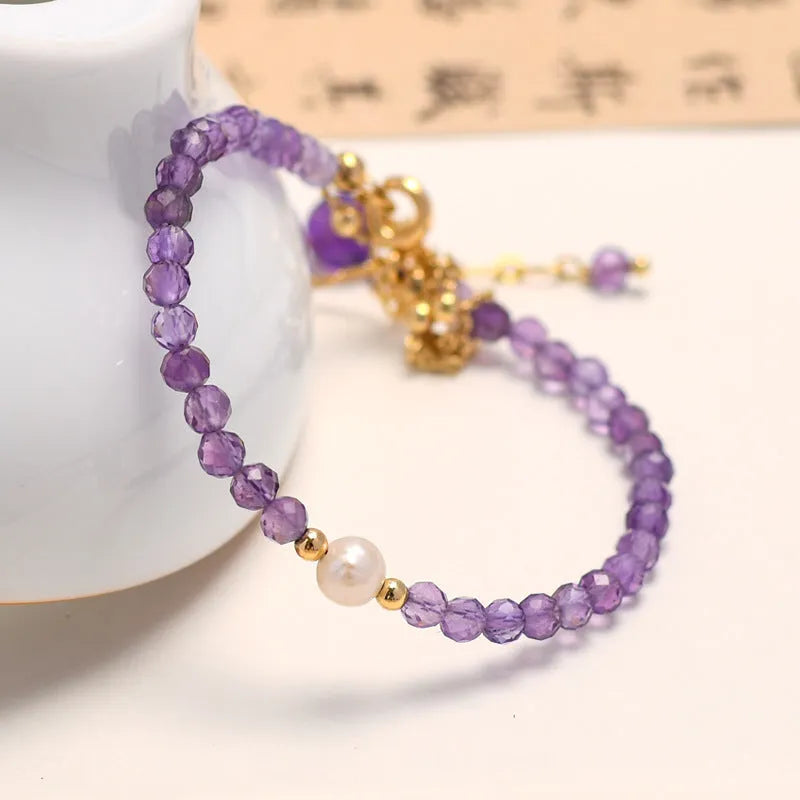 Amethyst colour crystal women's bracelet with diamond cut shapes and Chinese style design