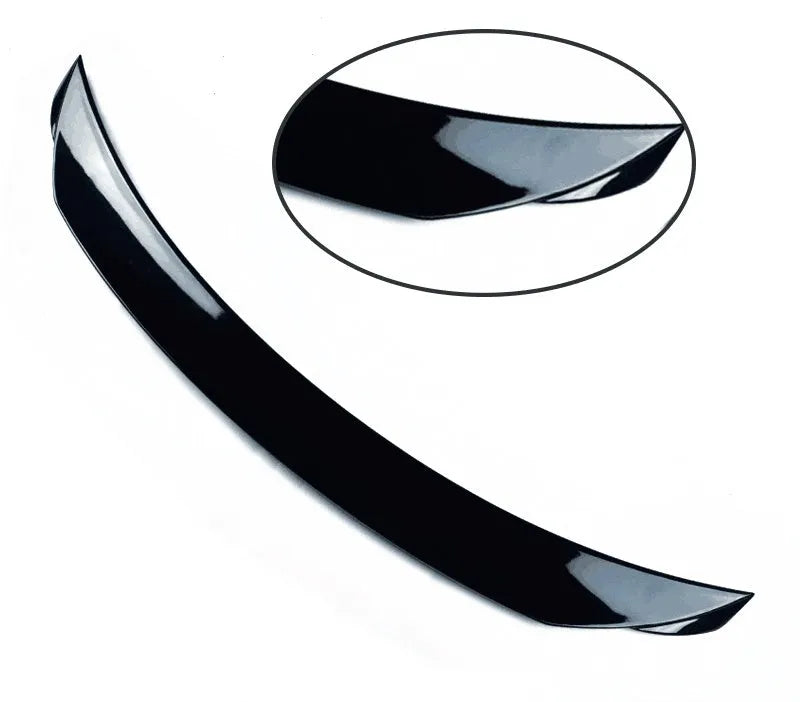 Mazda 3 Axela Exela tail trim in bright black with large fixed wind surround, showing precise fitment on vehicle rear