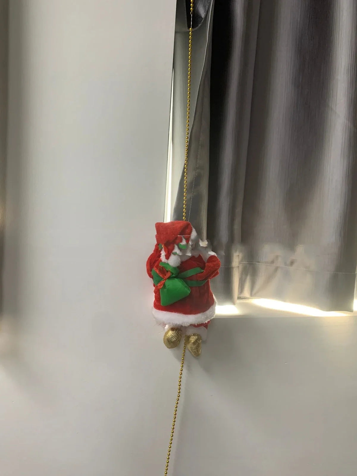 Electric plastic Santa Claus on 30cm climbing ladder with riding deer, in red suit, for Christmas decorations