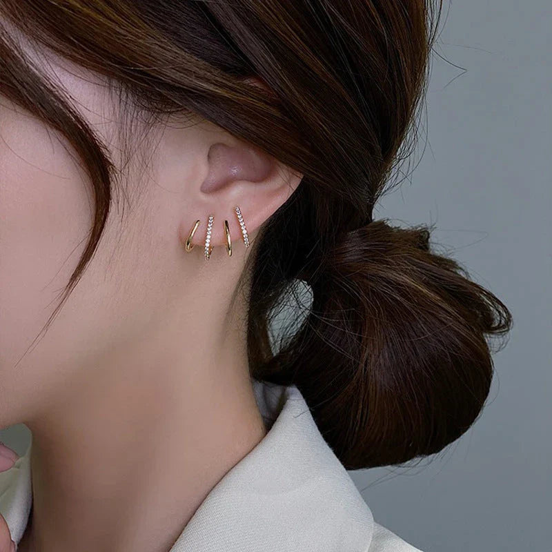 Elegant silver-tone zircon stud earrings with a sleek and sophisticated design
