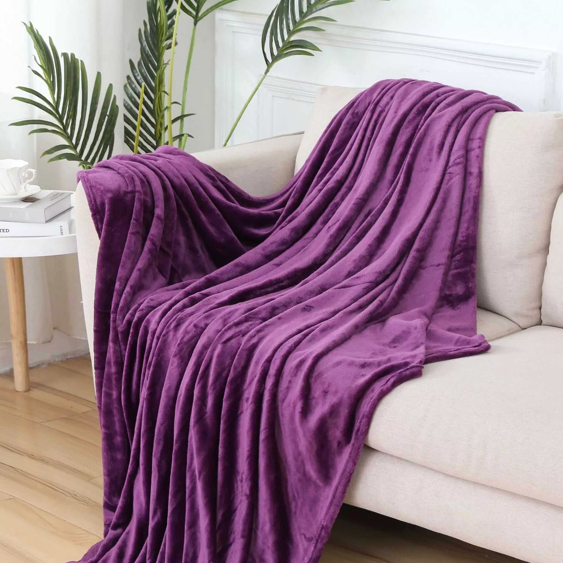 Solid color flannel blanket in various sizes and colors, made from durable polyester fiber