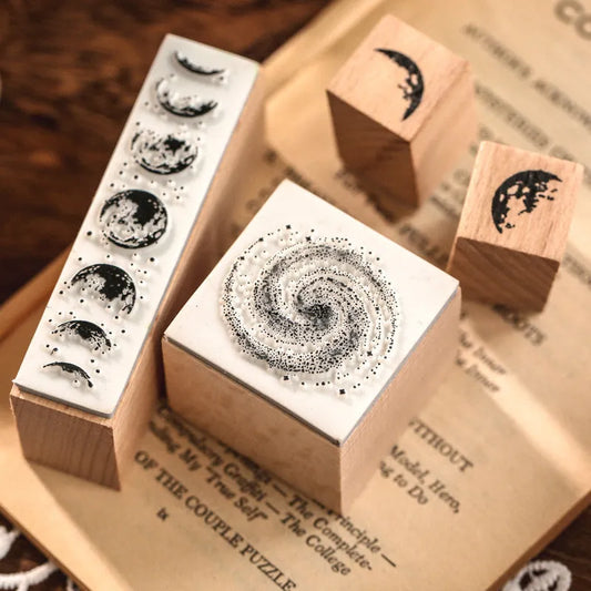 Wooden stamp set with seven hand-carved designs for journal decoration and personalised stationery