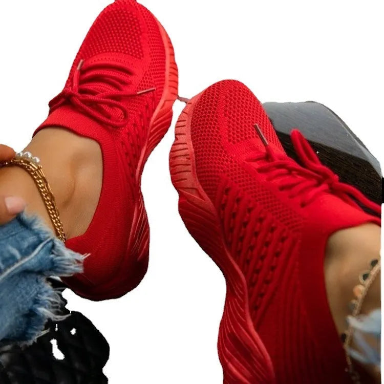 Women's solid colour sneakers with a thick sole, shown in multiple colour options.