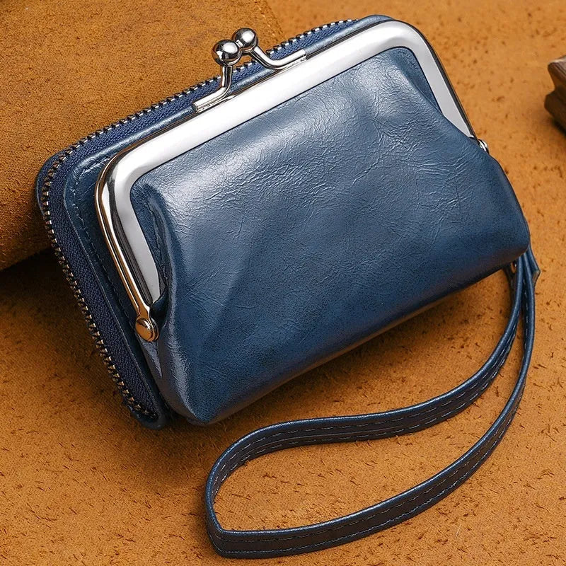 Ladies buckle-fastening coin purse with a 4-inch metal clip and zip, shown in multiple colour options.