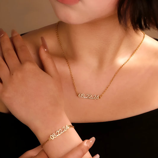 Stainless steel digital bracelet with diamond-set numbers showing time display in gold finish