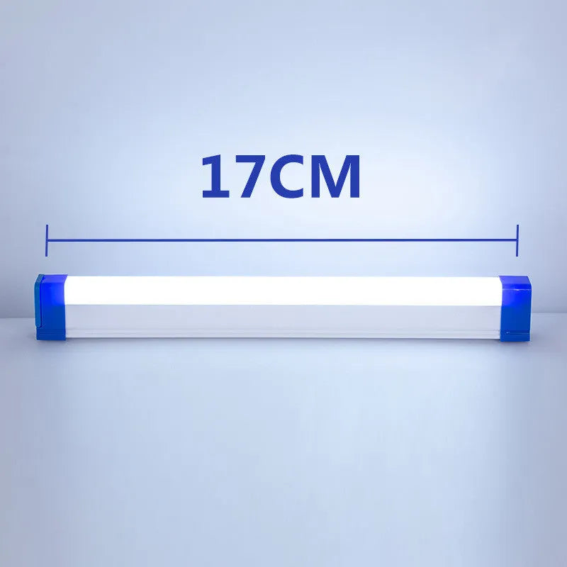 Blue rechargeable LED light tube with USB plug and push-button switch on a dark surface