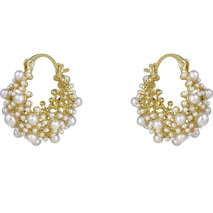 Gold-colour copper flower basket earrings with small rice-shaped bead inlay detail.