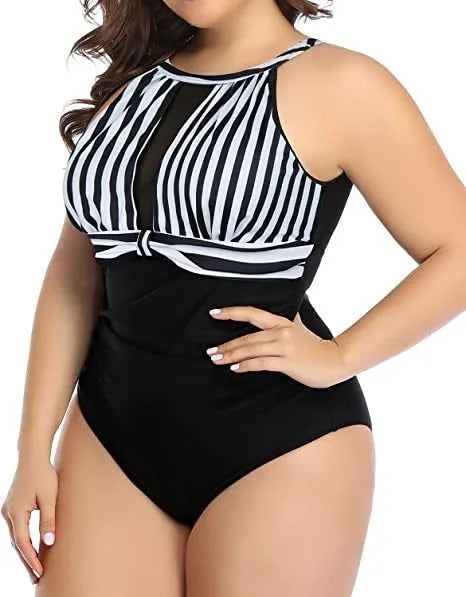Women's black one-piece swimsuit with lace trim on a mannequin, showing front design.