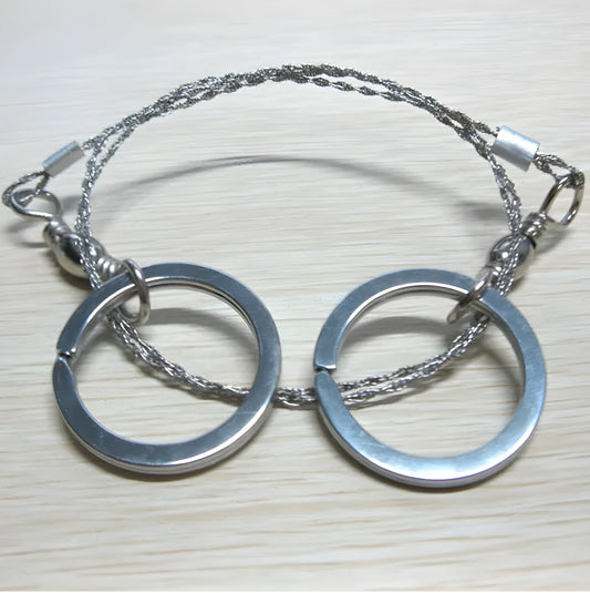 Outdoor survival wire saw with stainless steel blade and pull ring handles for camping and bushcraft