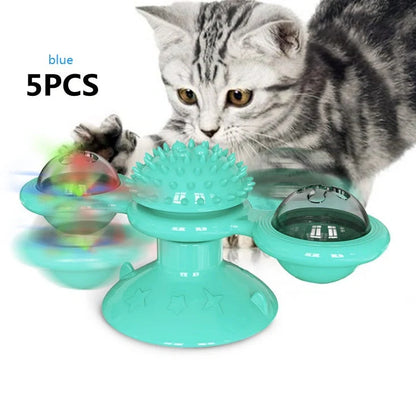 Cat playing with rotating windmill toy featuring suction base and luminous ball