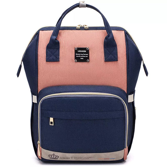 Mummy Maternity Bag in various colors, featuring a backpack design and zipper closure