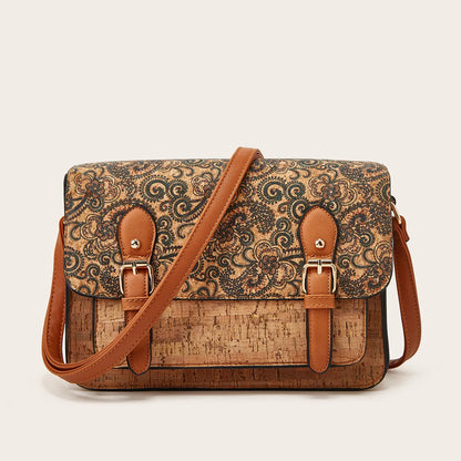 Women's one-shoulder crossbody bag with printed design in green colour, showing large capacity and single strap.