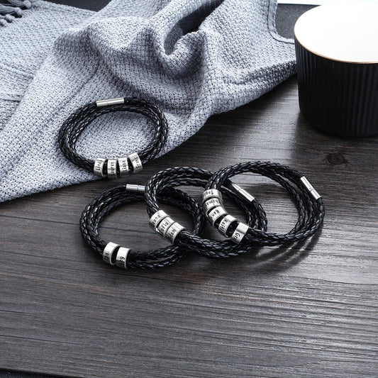 Personalized men's braided leather bracelet with stainless steel beads and custom name charm