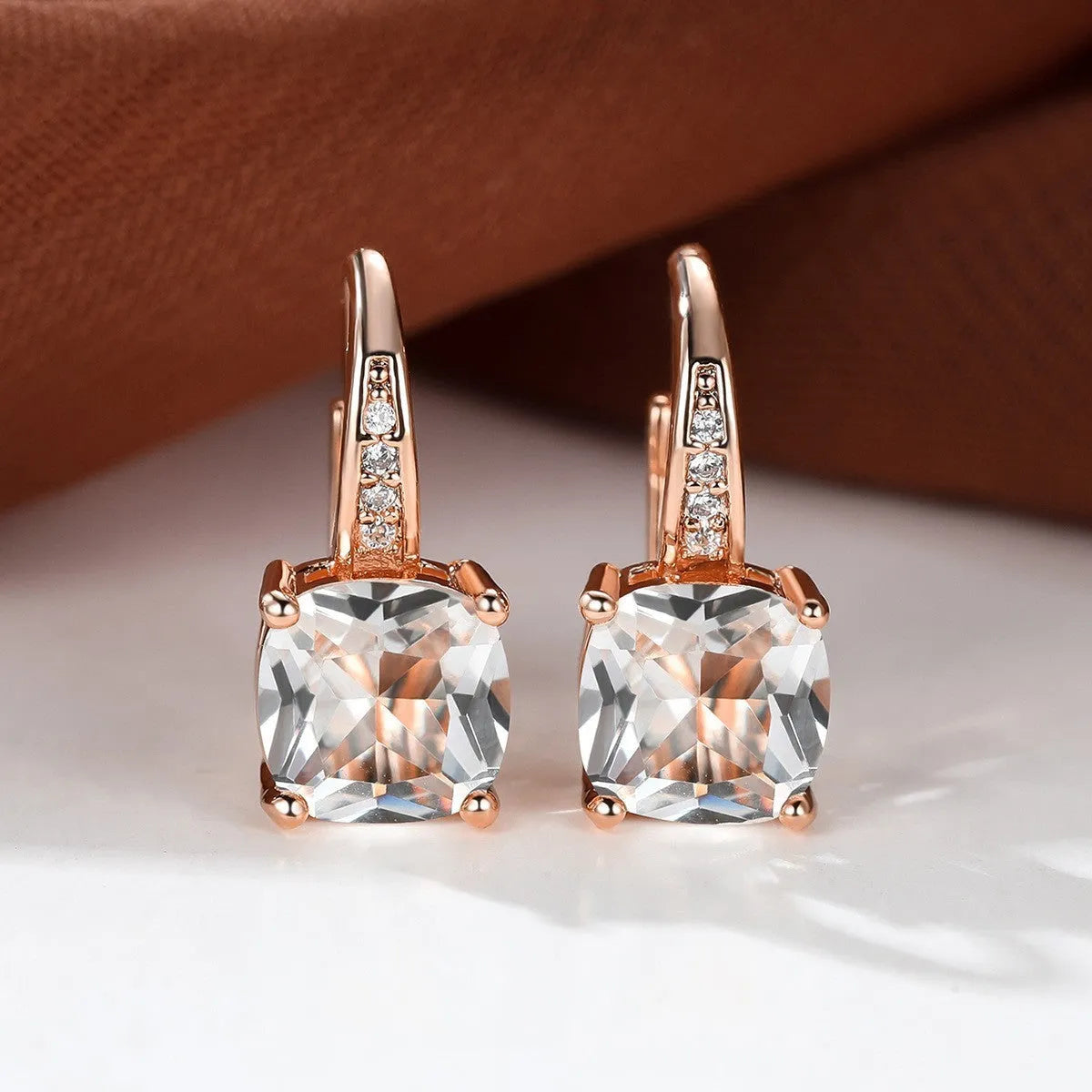 Square zircon inlaid ear hook earrings with geometric design and electroplated finish in golden tone