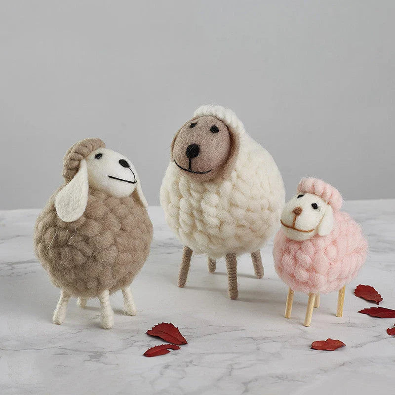 Adorable plush sheep decorations in various sizes and color combinations, perfect for adding a cozy, farmhouse-inspired touch to any home.