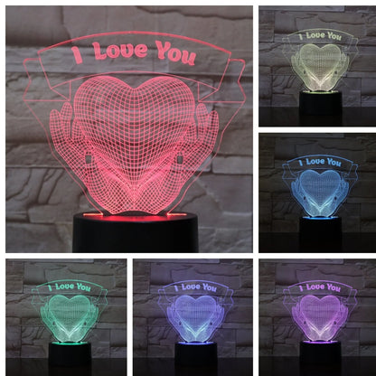 3D acrylic night light with hands holding heart design, showing seven colour options and remote control
