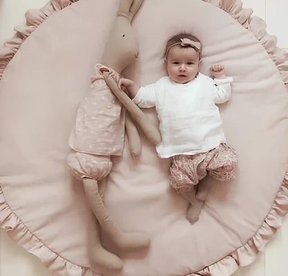 Circular baby play mat with lace border showing 2cm thickness measurement