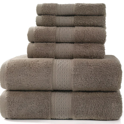 Cotton towel set showing bath towel, hand towel, and face cloth in coordinated sizes