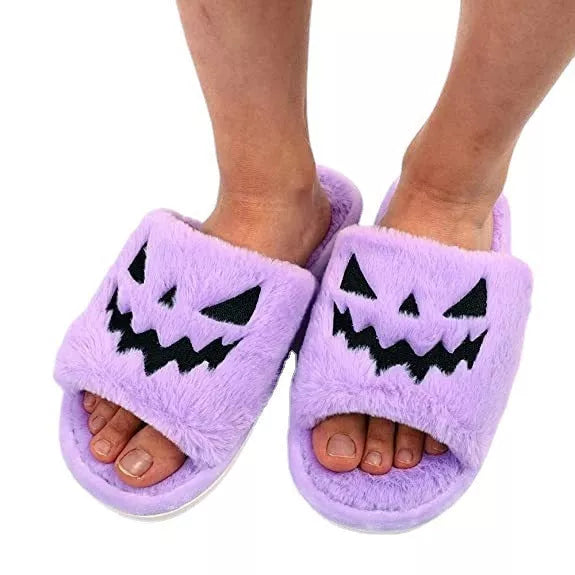 Women's Halloween winter slippers with rabbit fur uppers and PU soles in purple, black, pink, or orange.