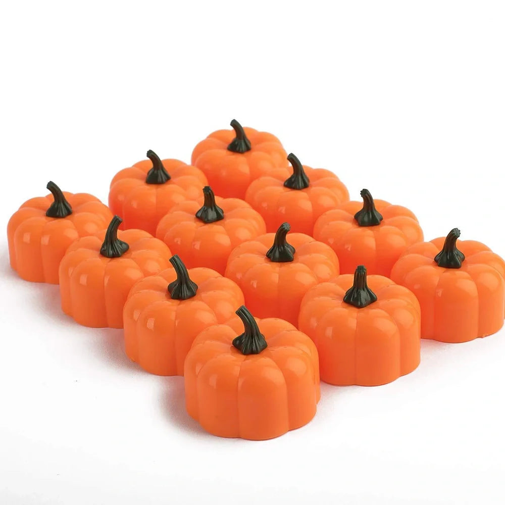 12 yellow LED pumpkin lights with electronic candle function measuring 4.9x4.3cm