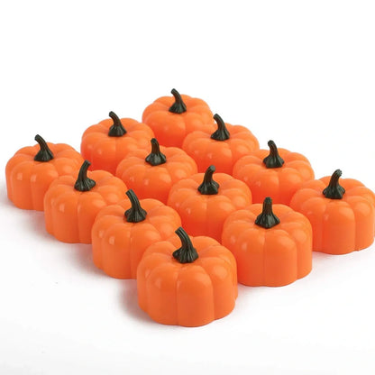 12 yellow LED pumpkin lights with electronic candle function measuring 4.9x4.3cm