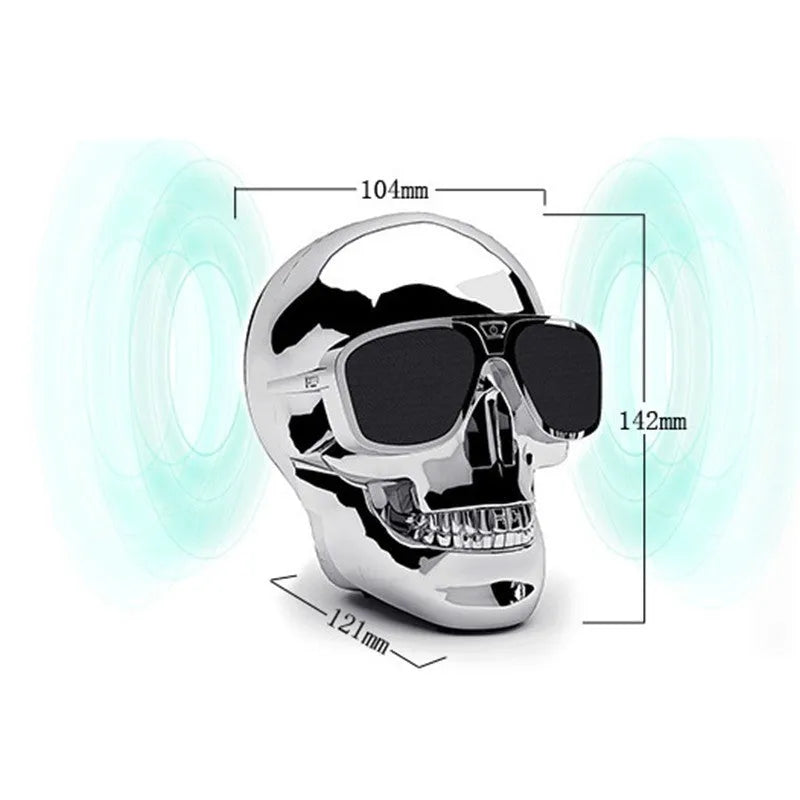 Limited edition Skull-shaped portable wireless Bluetooth speaker in various colours on a table.