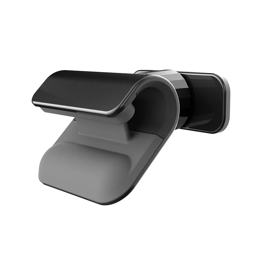 Black universal car phone holder with ball joint, mounted on a car dashboard, holding a mobile phone.