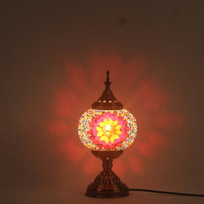 Glass table lamp with 150mm diameter shade and 330cm cord on wooden surface