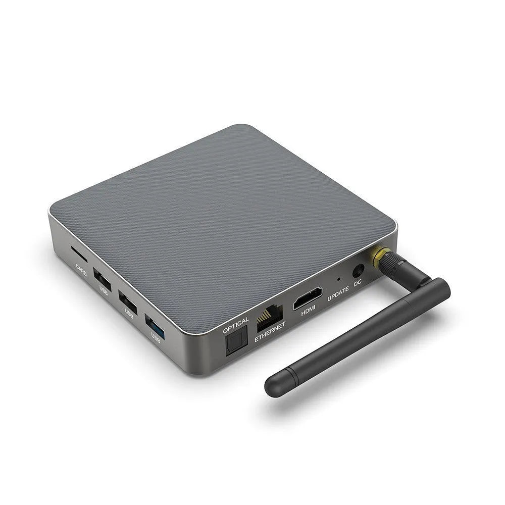 Android TV set-top box with remote control showing HDMI and power ports