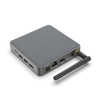 Android TV set-top box with remote control showing HDMI and power ports