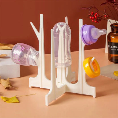 Creative tree branch design baby bottle drying rack in blue, yellow, white, and nude